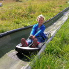 Girl on summer toboggan ride in Lake Bled, Slovenia