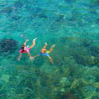 Kids snorkelling in the sea