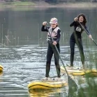 A family enjoying paddleboarding in Peru