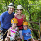Family taking part in a ziplining excursion in Costa Rica