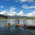 Stand-up paddleboarding on Huaypo Lagoon in Peru