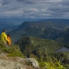 Hikers enjoying a view of the Chic-Chocs Mountains, in Gaspesie National Park, Canada.