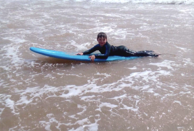 Boy surfing in Morocco