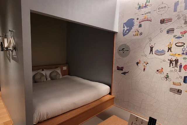 View of a double bed in an Omo7 room.