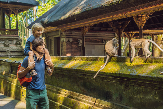 Father and son exploring a temple in Bali, Indonesia
