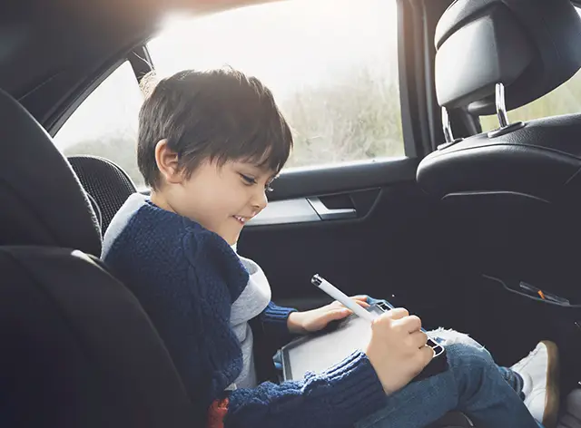 Boy in car
