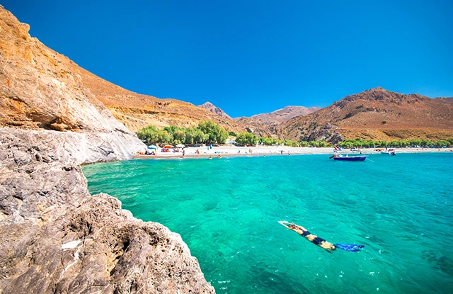 Girl snorkelling in Crete, Greece