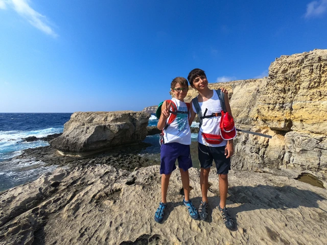 Siblings on the coast on holiday in Gozo