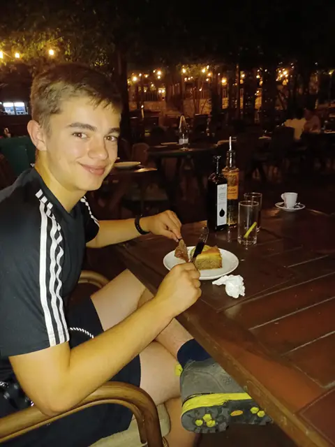 Boy eating cake in Montenegro