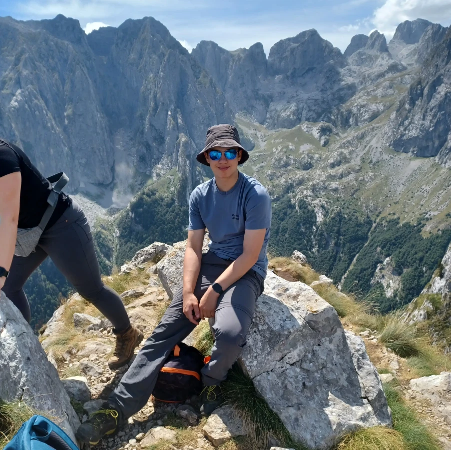 Boy with view behind him in Montenegro