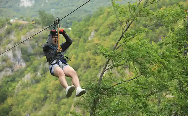 Boy ziplining in Montenegro
