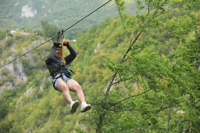 Boy ziplining in Montenegro
