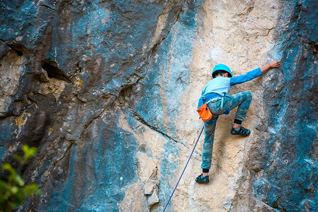 Child rock climbing in Spain