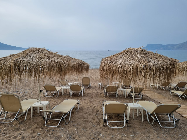 Sunbeds on a beach in Crete, Greece.
