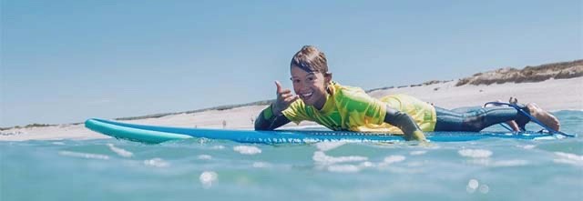 Boy surfing in Portugal