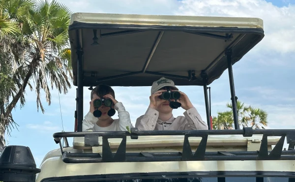 The Siddon family observing wildlife in Tanzania.