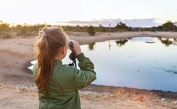 Girl on safari looking out to the horizon
