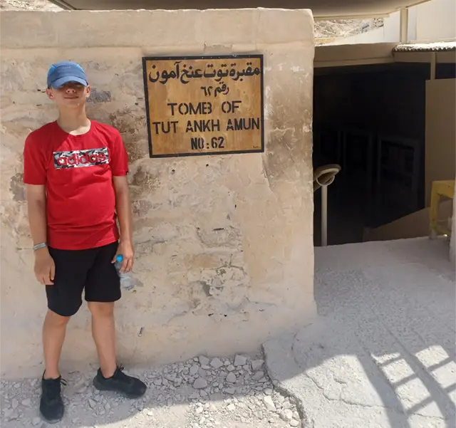 Boy at Tutankhamen's tomb in Egypt