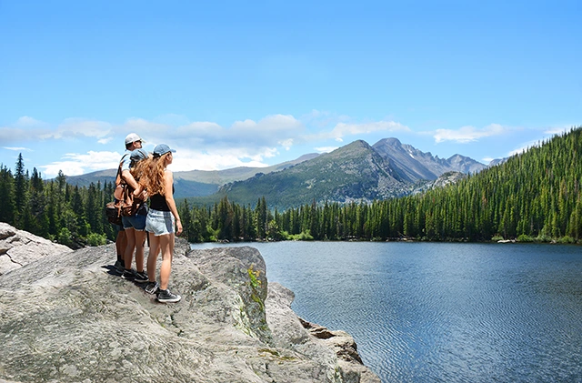 Family looking at the views over the Rocky Mountains