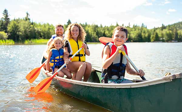 Family canoeing in Canada