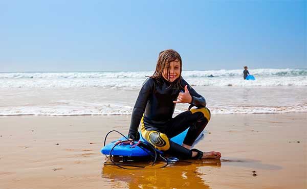 Boy surfing in Morocco