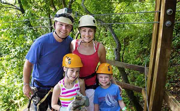 Family taking part in a ziplining excursion in Costa Rica