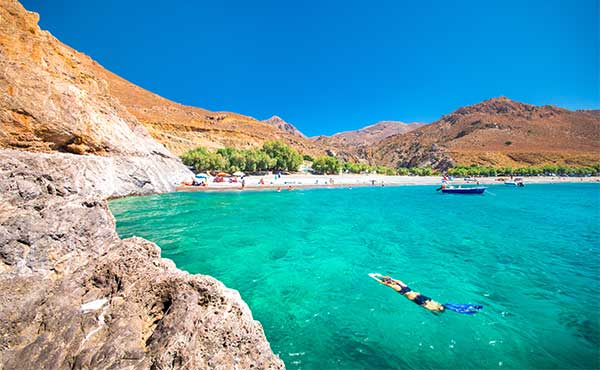 Girl swimming in Crete