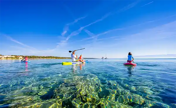 Family paddleboarding in Croatia