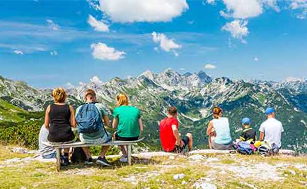 Family group looking out to Triglav National Park in Slovenia